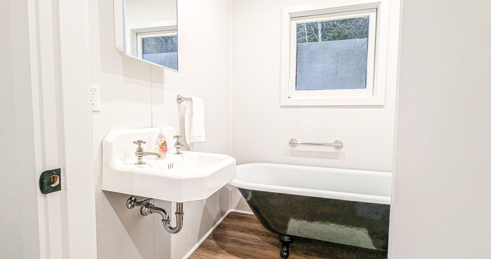 Bathroom with Antique Restored Clawfoot Tub and Sink and modern low flow toilet